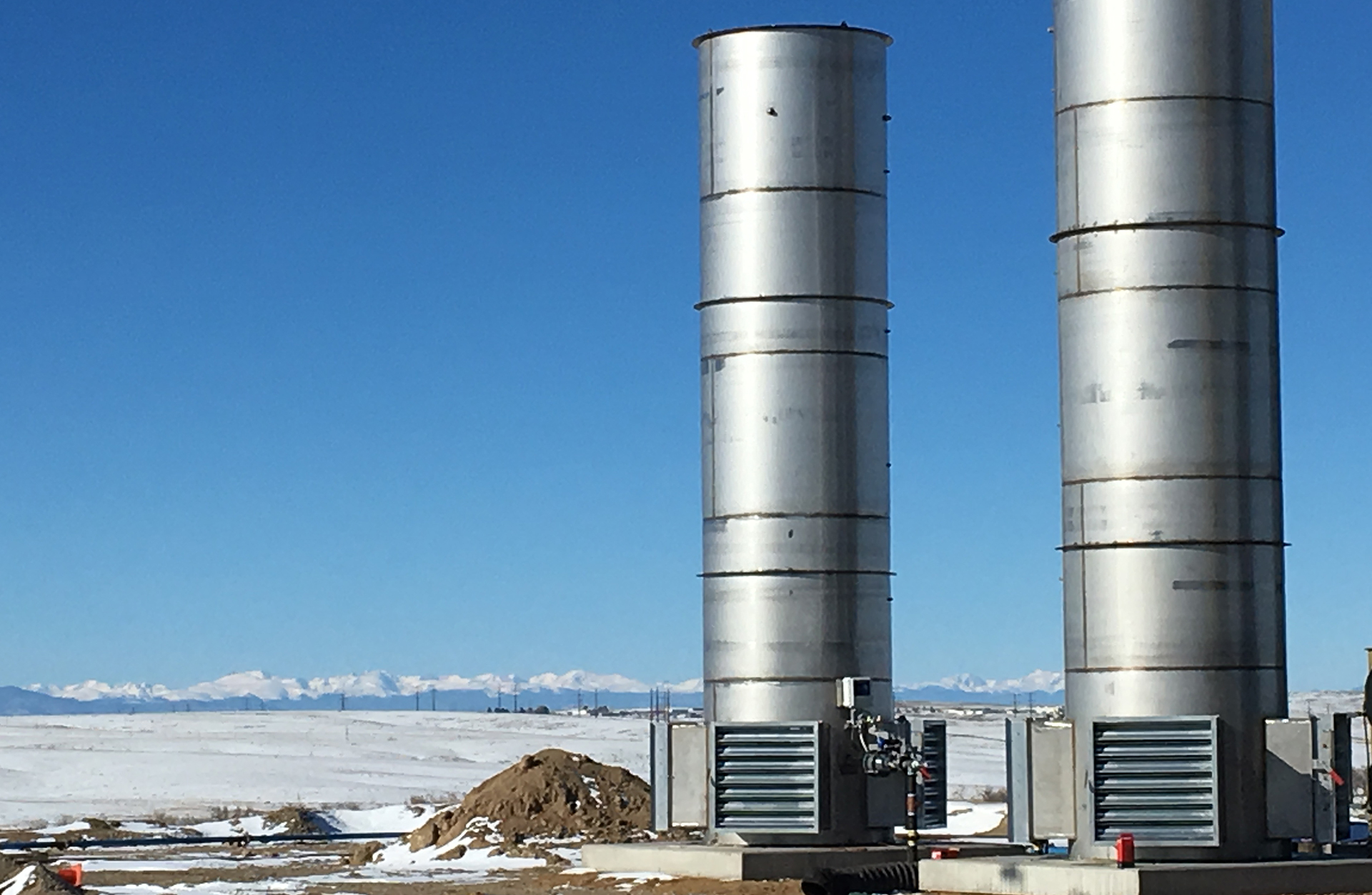 Enclosed Combustor in snow on oilfield production site